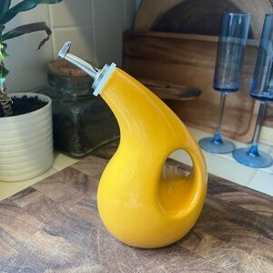 Mustard yellow olive oil pour bottle